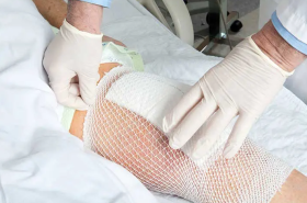 A bandage being placed on a wound
