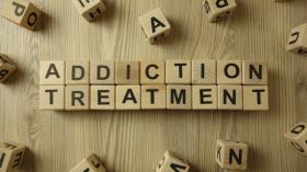 Dice spelling out addiction treatment
