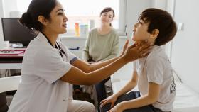 Clinician examining a child